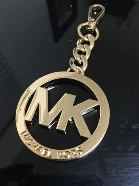 michael kors emblem replacement.